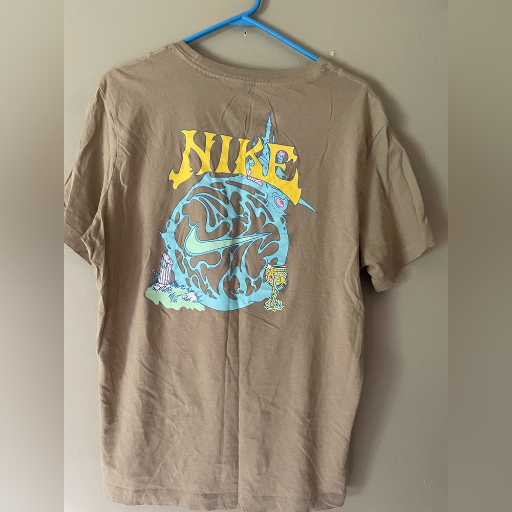 Nike short sleeved tee shirt , beige with blue green and pink design, size large